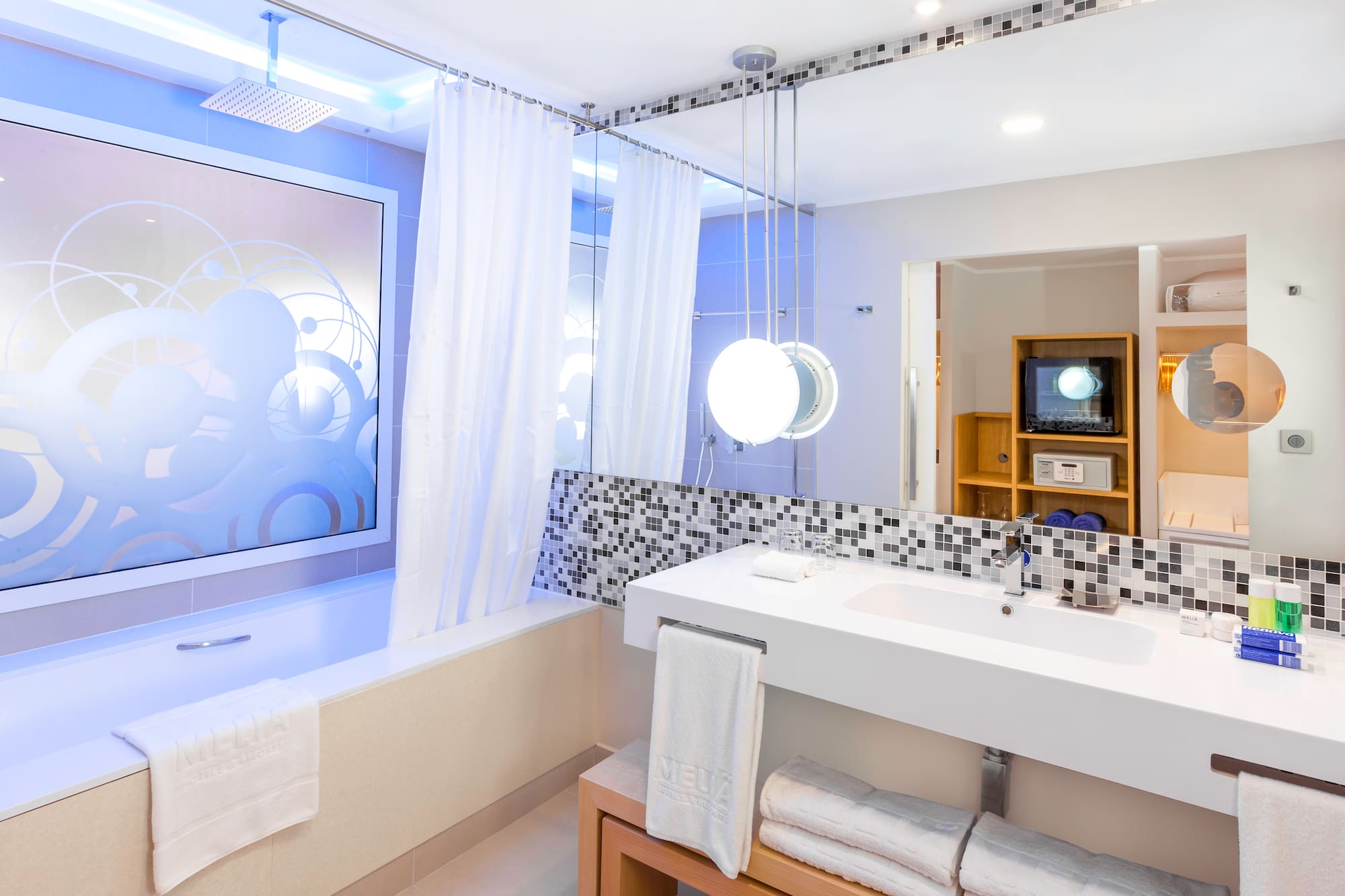 a bathroom with a bathtub and a sink