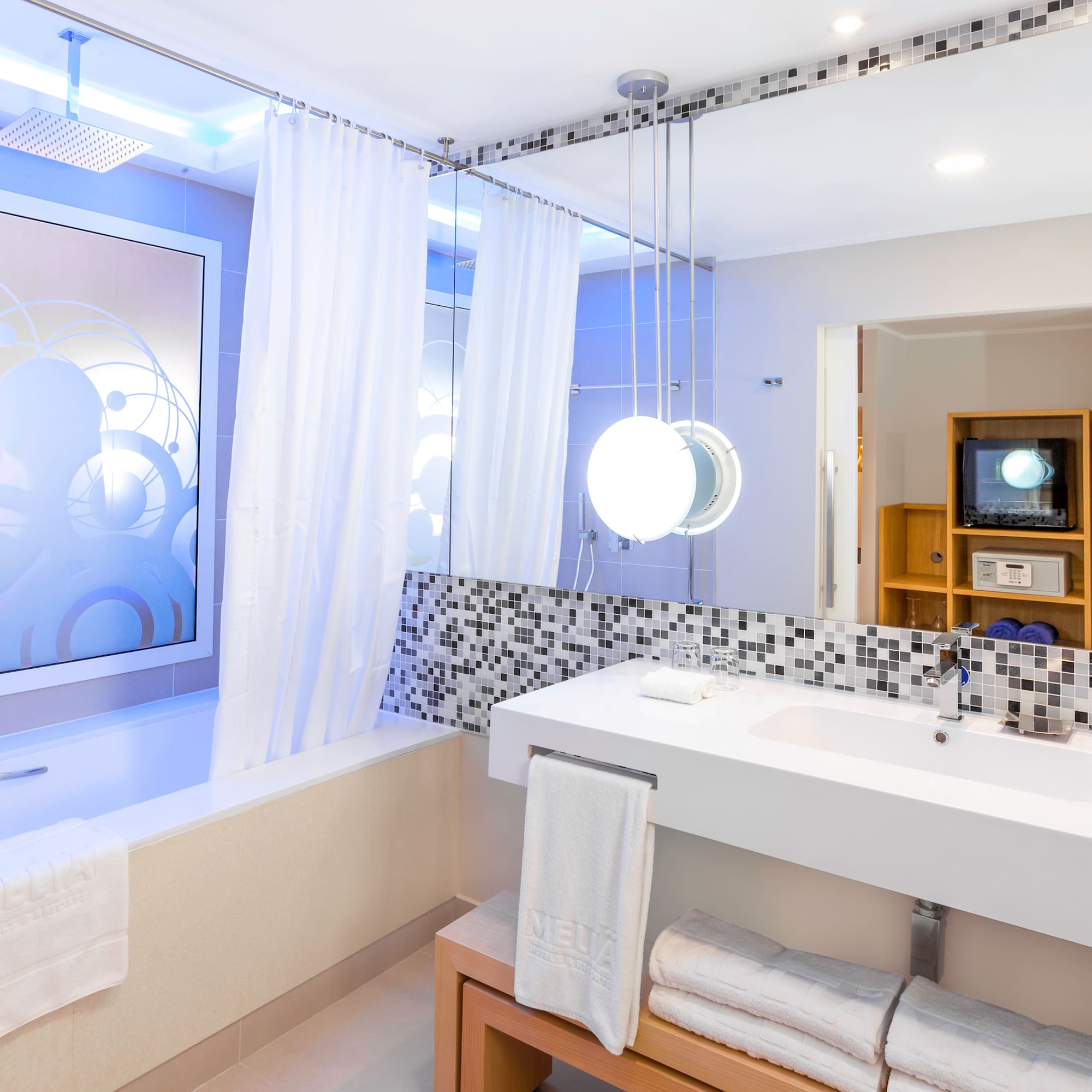 a bathroom with a bathtub and a sink