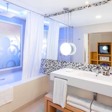 a bathroom with a bathtub and a sink