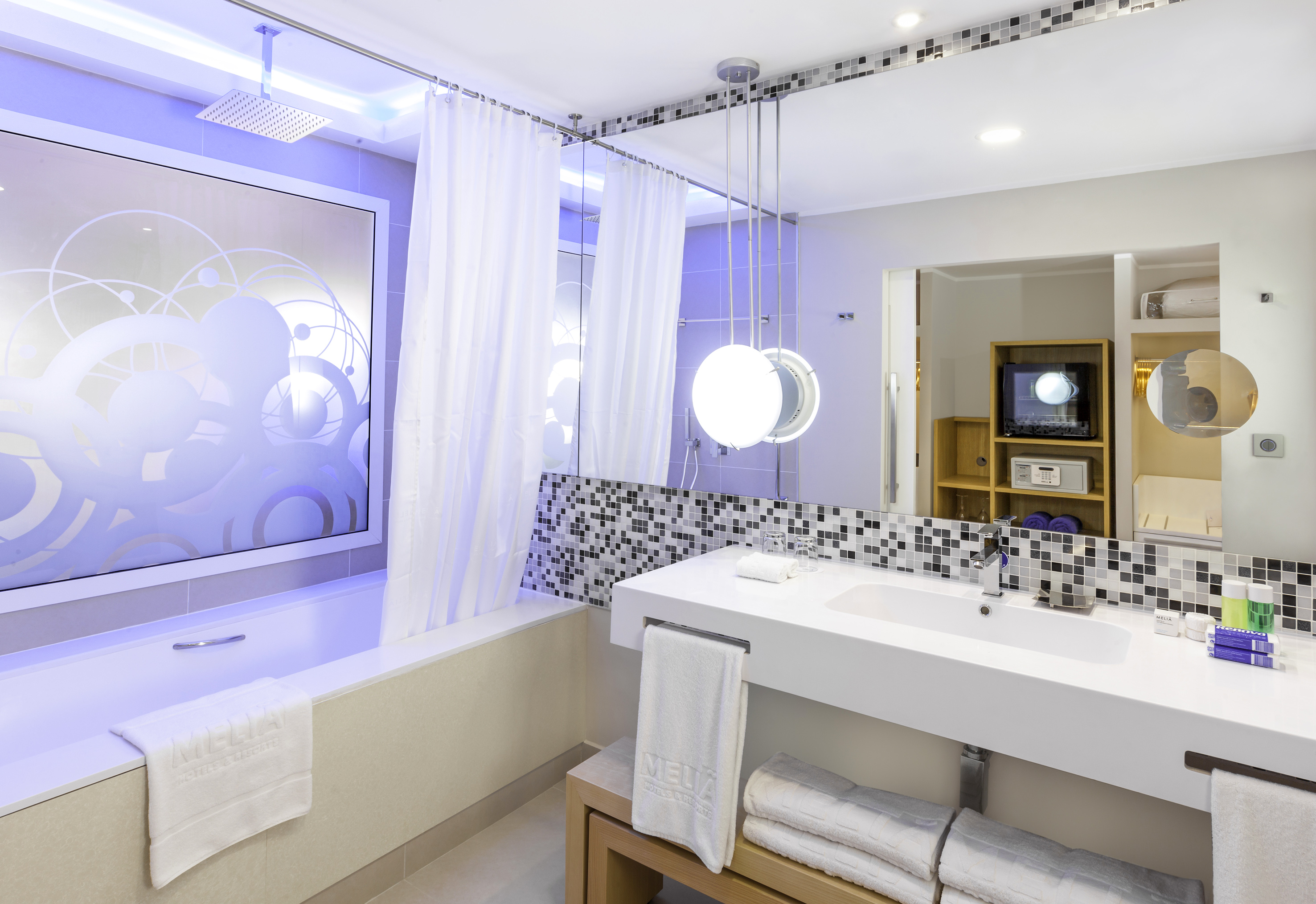 a bathroom with a bathtub and a sink