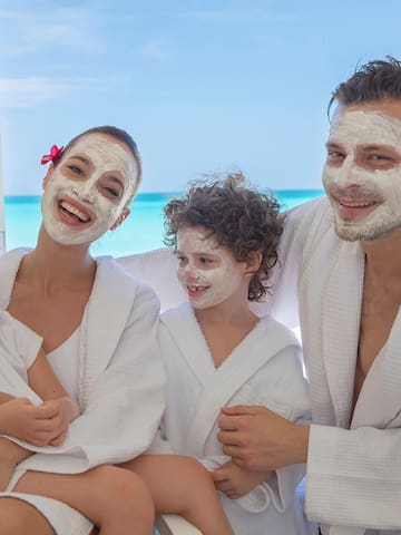 a group of people with white facial masks