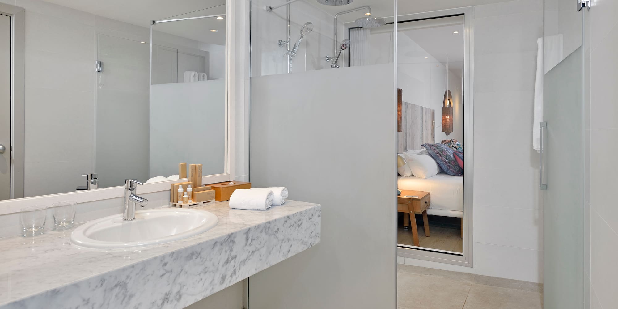 a bathroom with a glass shower door