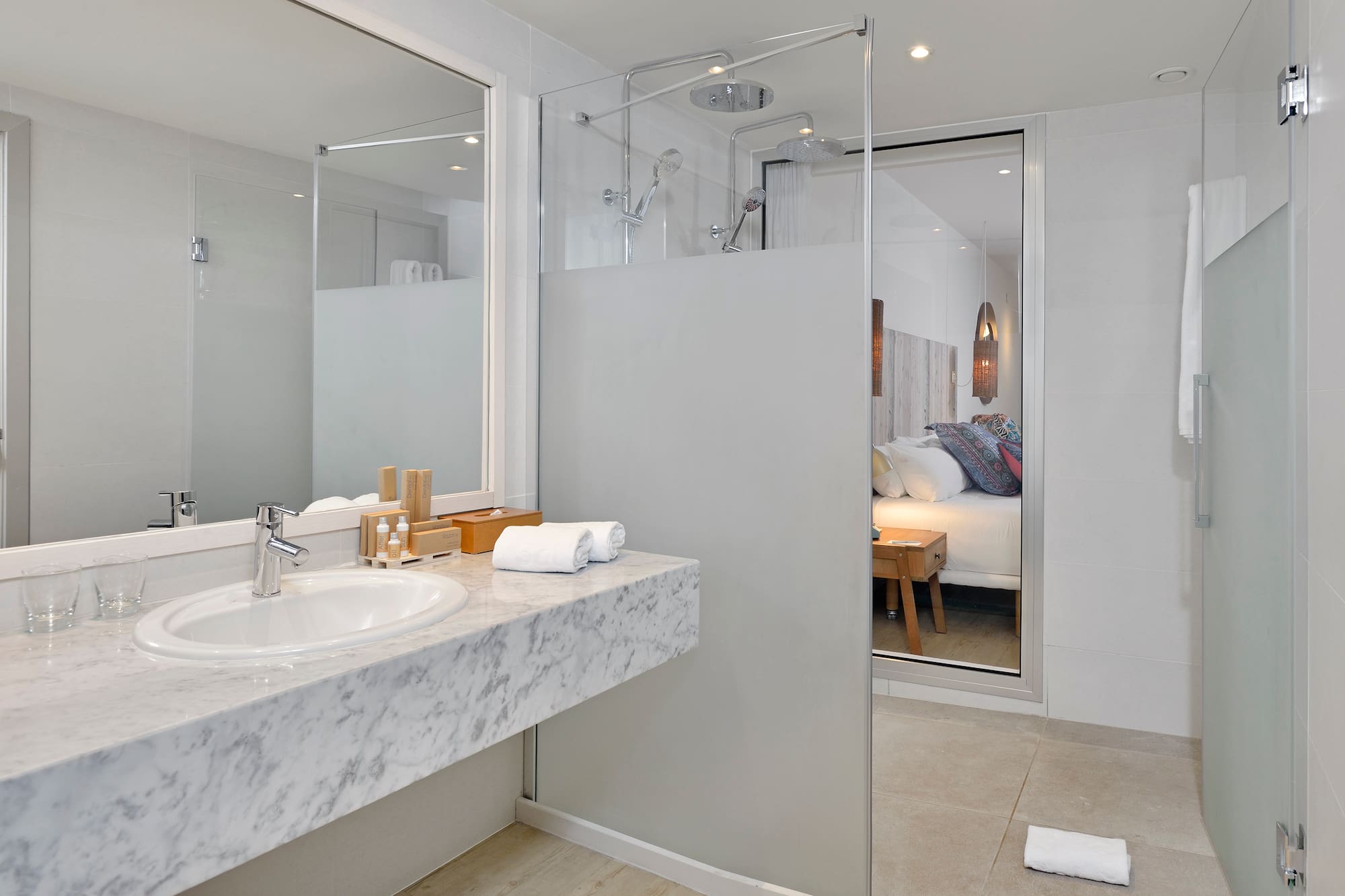 a bathroom with a glass shower door