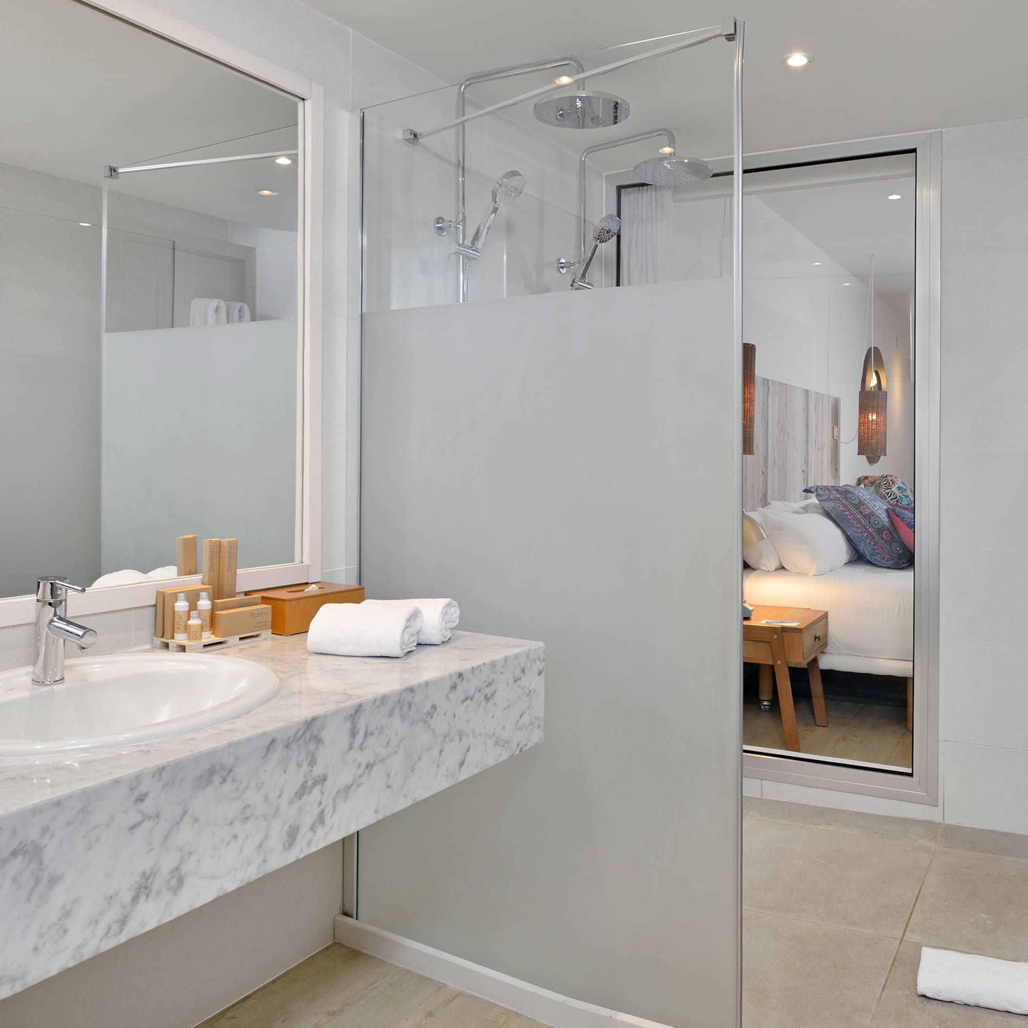 a bathroom with a glass shower door