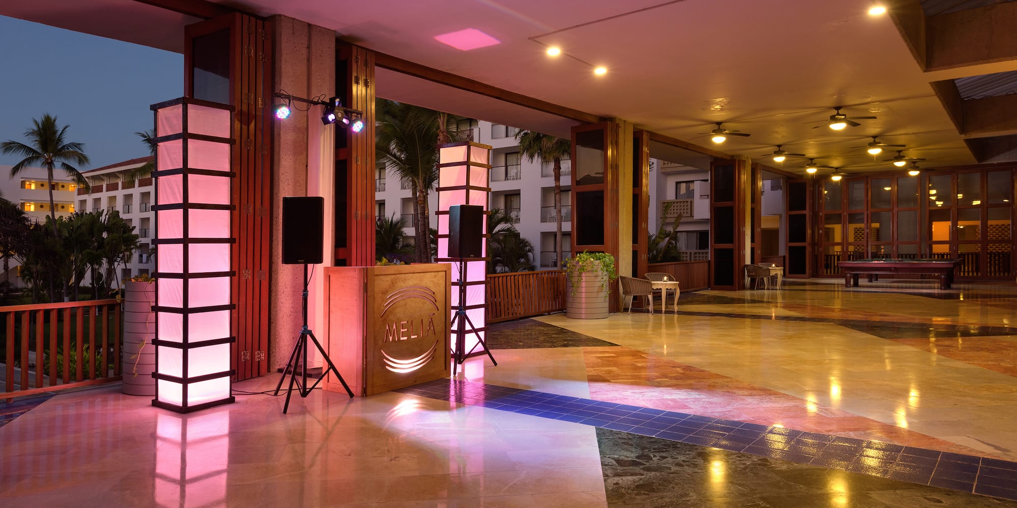 a room with a large screen and a large screen