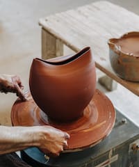 a man working on a pottery wheel