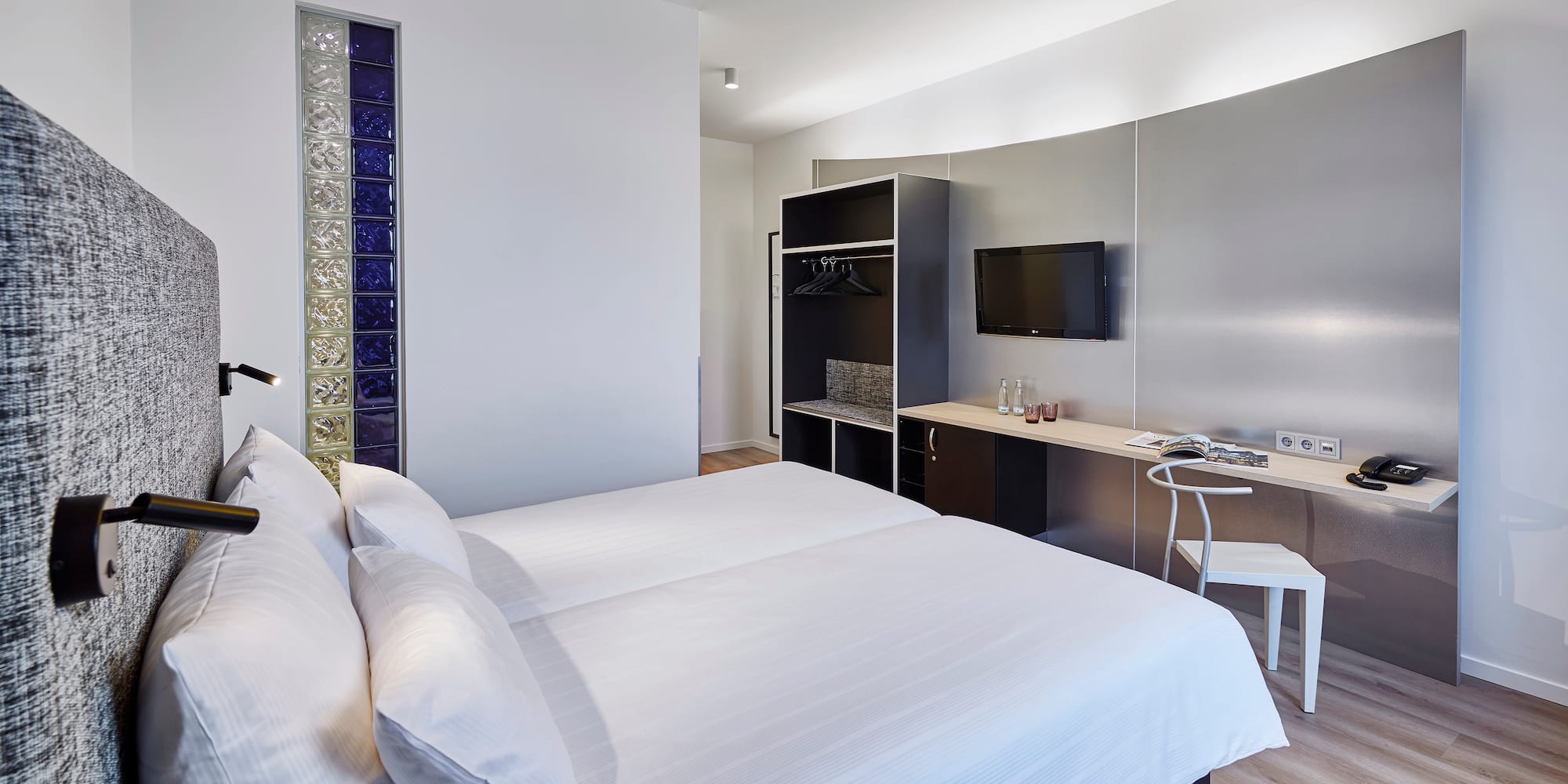 a room with a bed and a desk