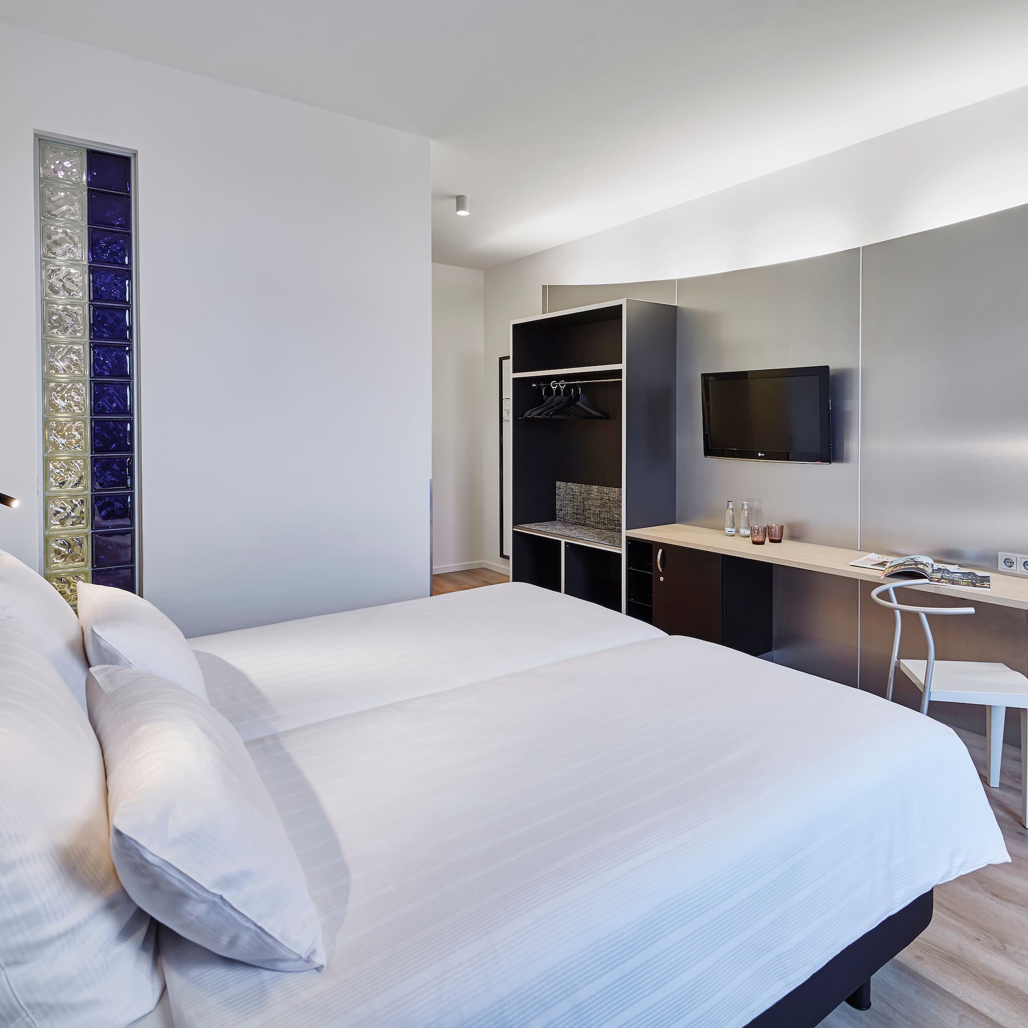 a room with a bed and a desk