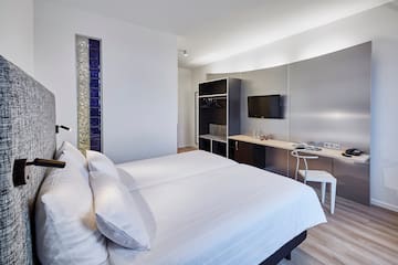 a room with a bed and a desk