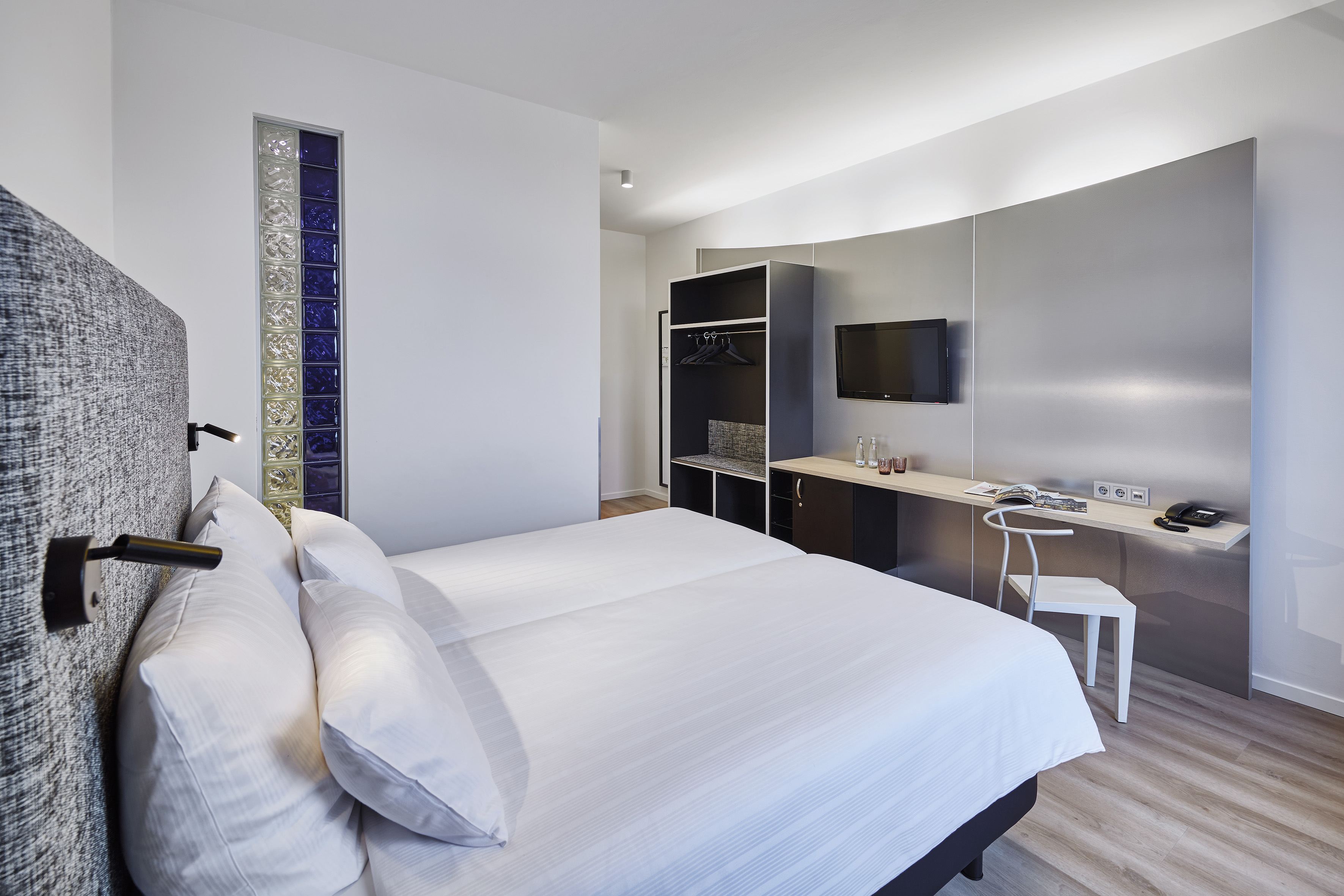 a room with a bed and a desk