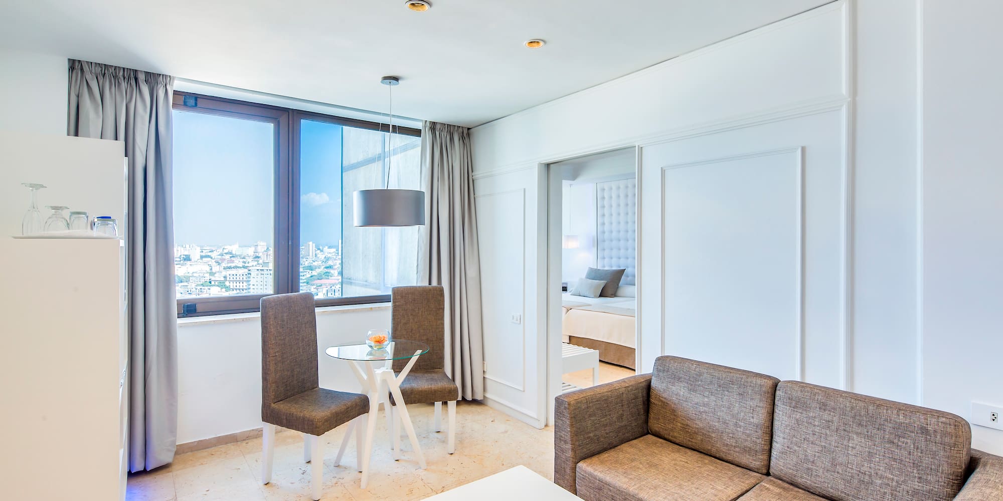 a living room with a couch and chairs