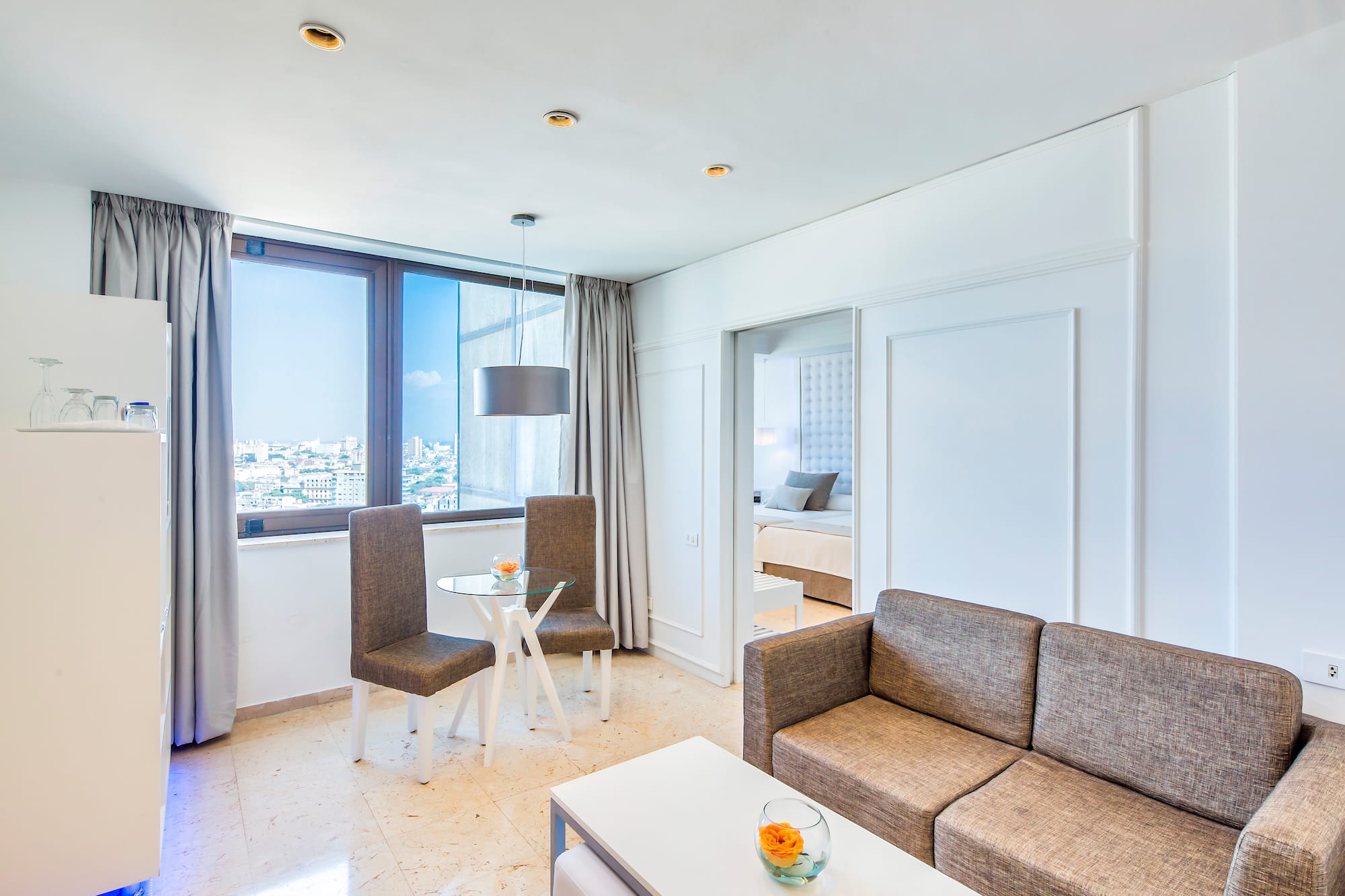 a living room with a couch and chairs