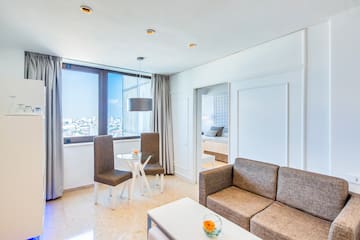 a living room with a couch and chairs