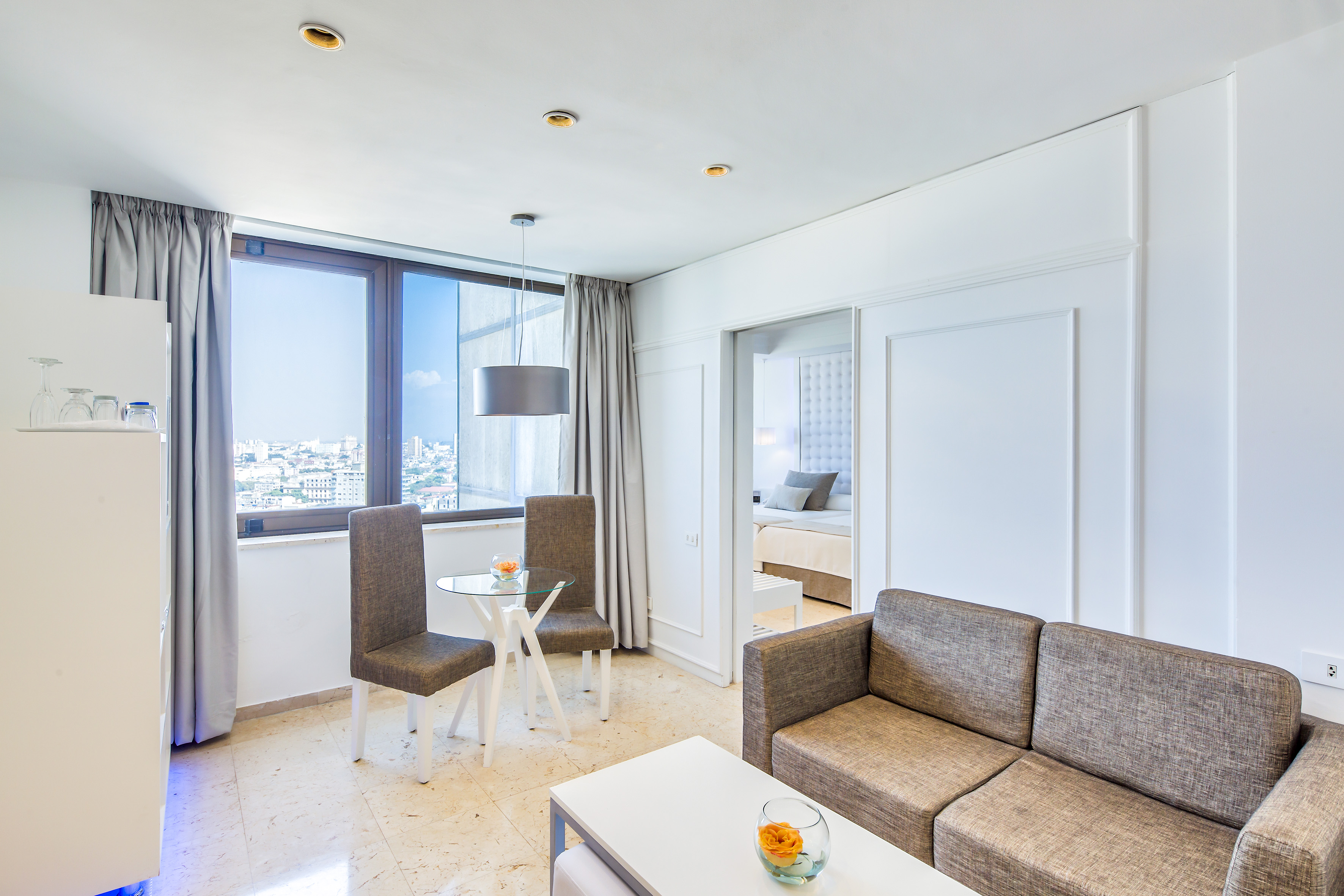 a living room with a couch and chairs