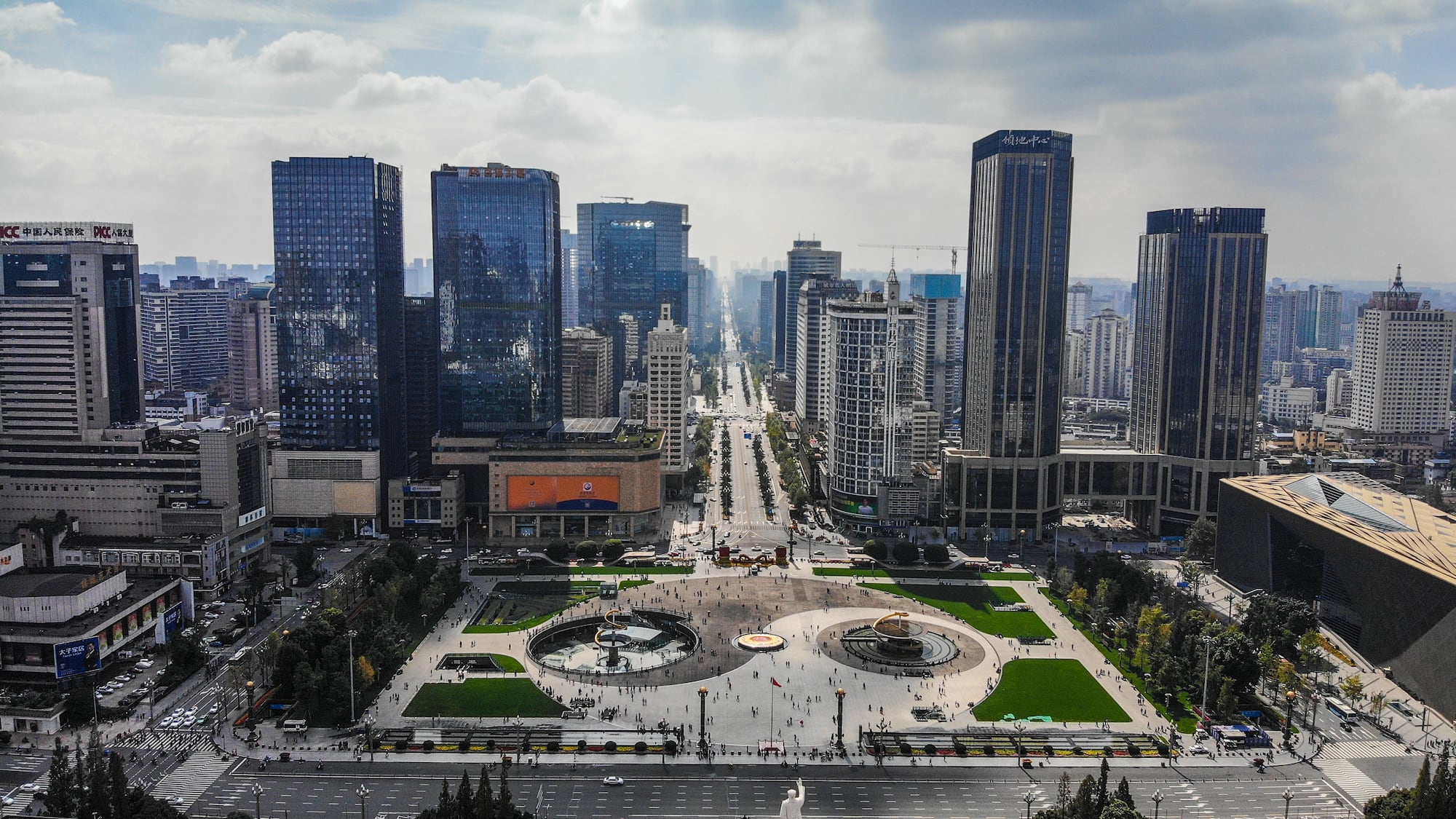 a city with a fountain and buildings