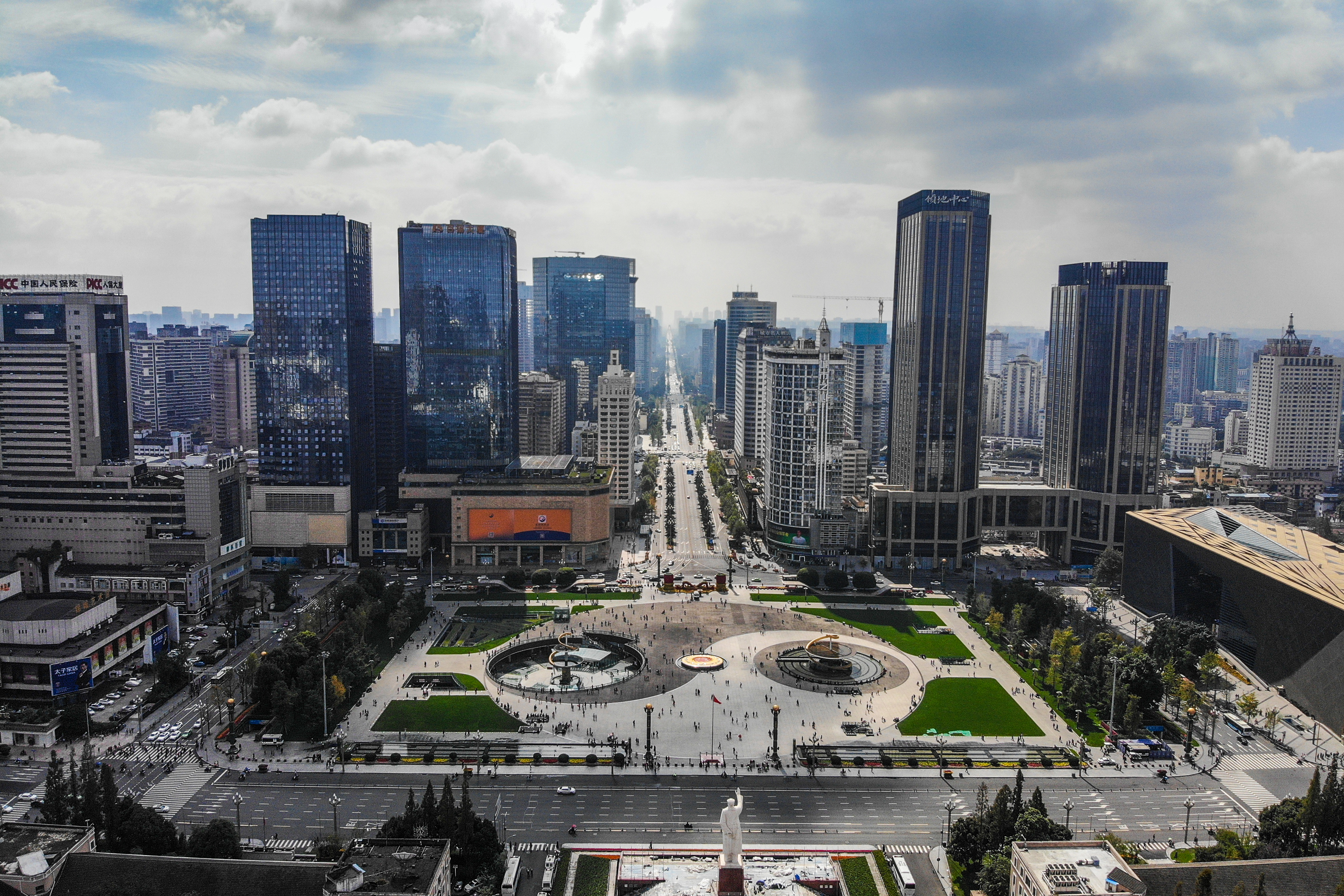 a city with a fountain and buildings