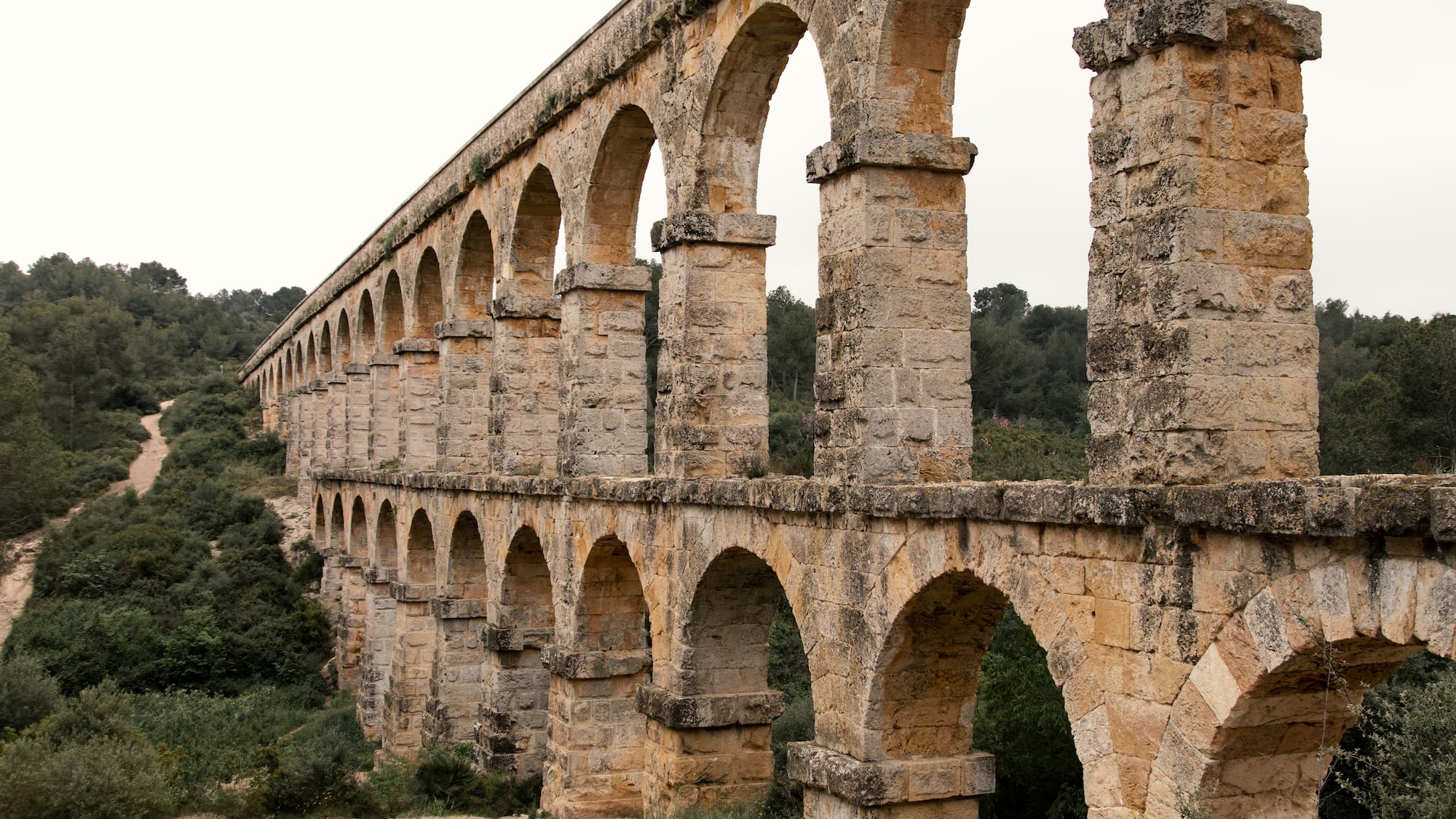 a stone bridge with arches