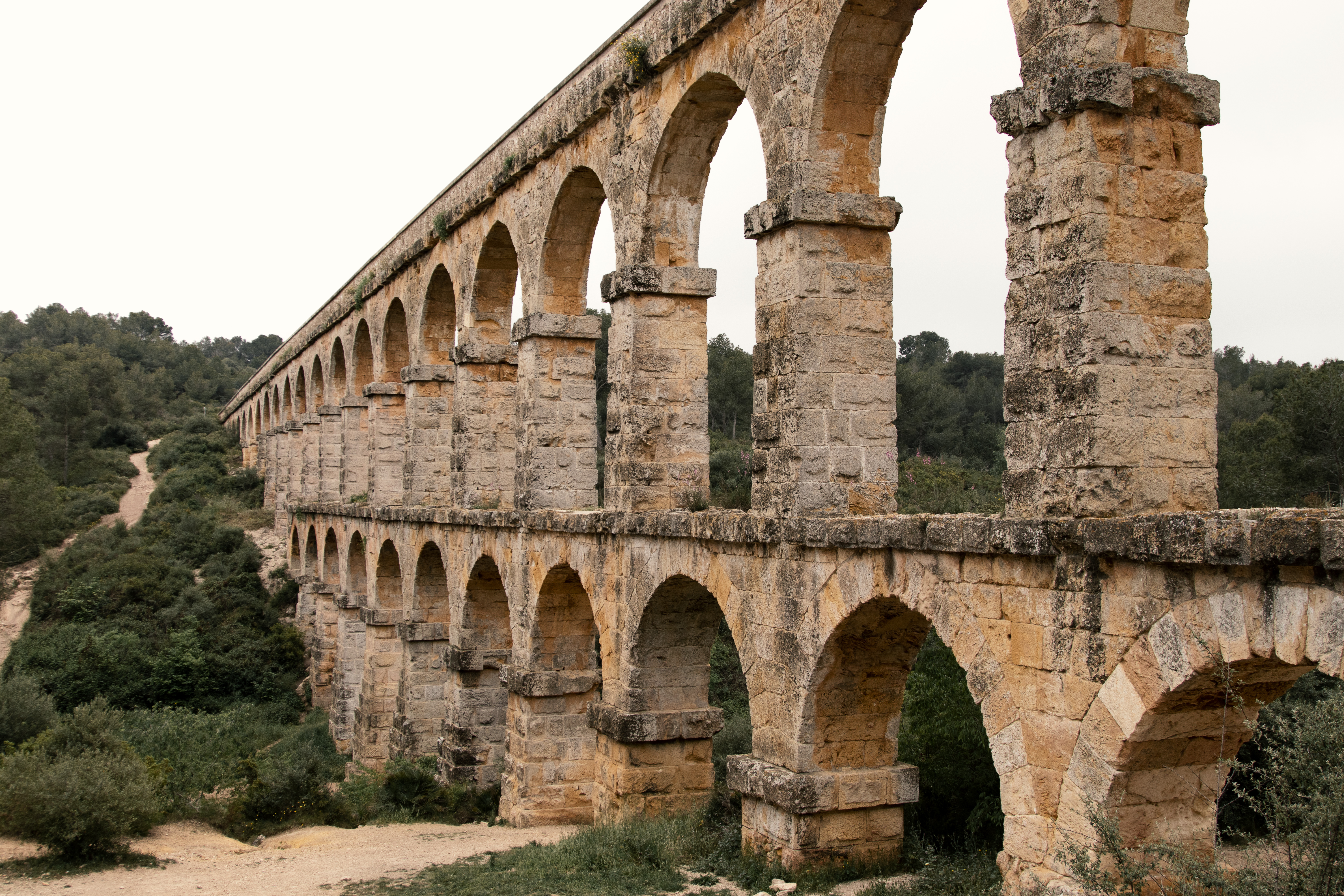 a stone bridge with arches