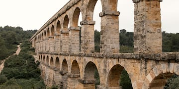 a stone bridge with arches