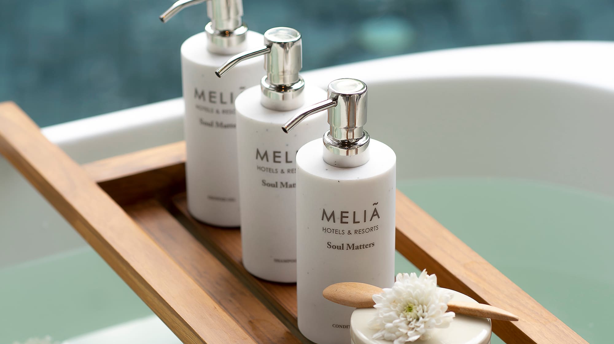 a group of white bottles on a wooden tray