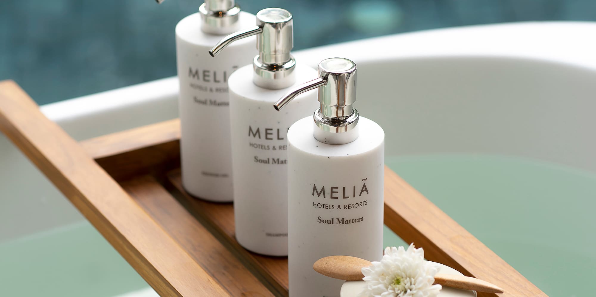 a group of white bottles on a wooden tray