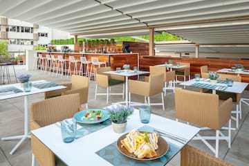a table and chairs with food on it