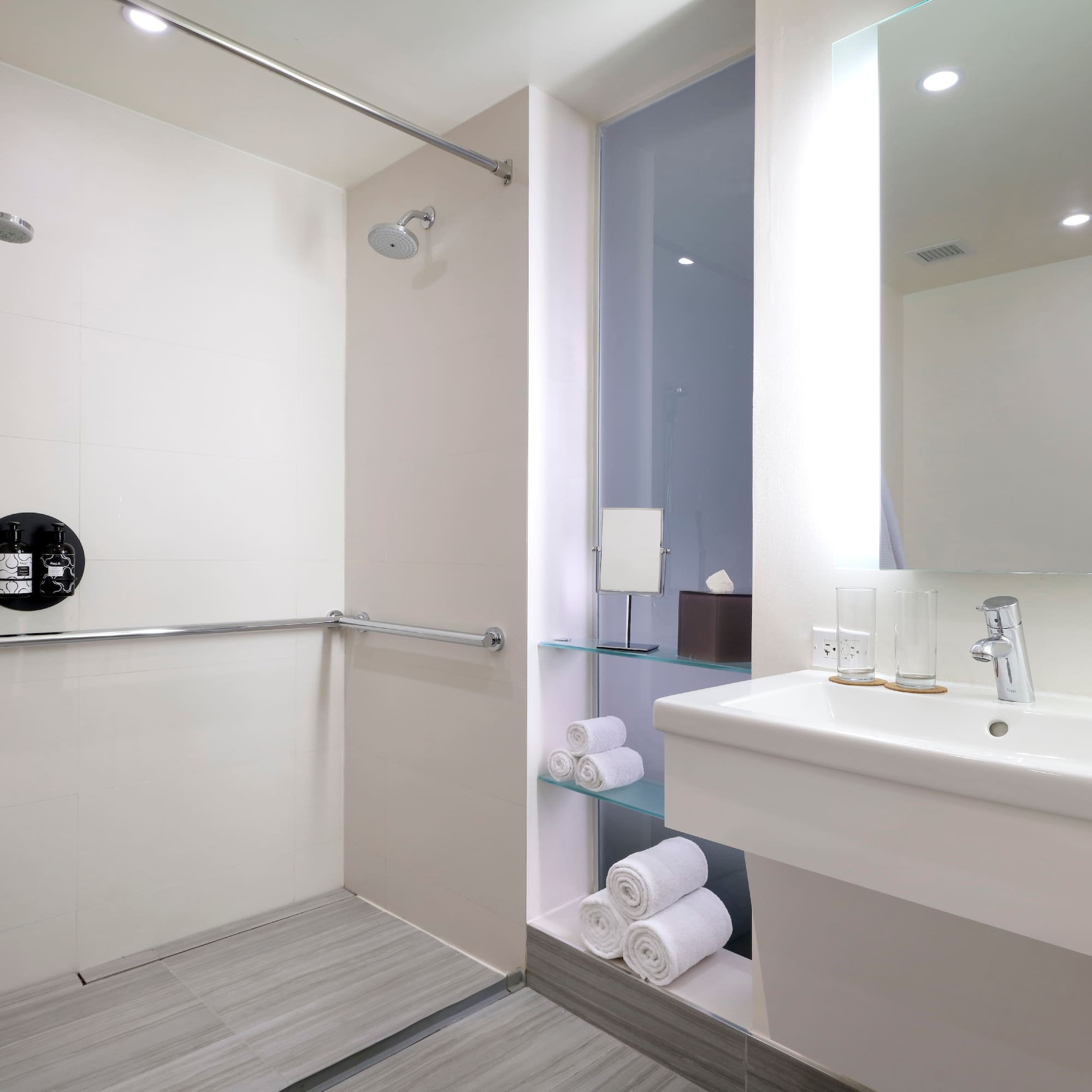 a bathroom with a shower and sink