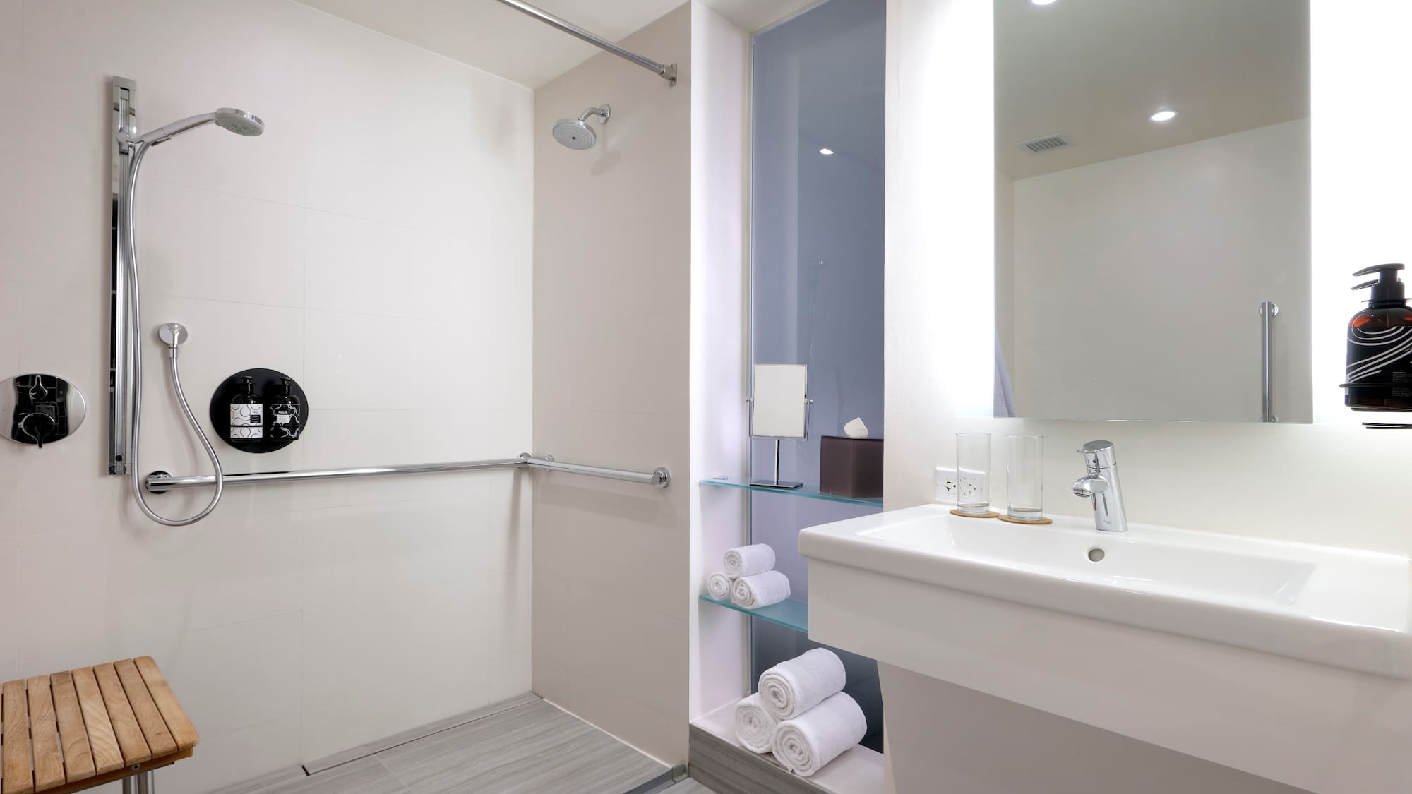 a bathroom with a shower and sink