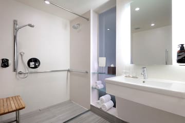 a bathroom with a shower and sink