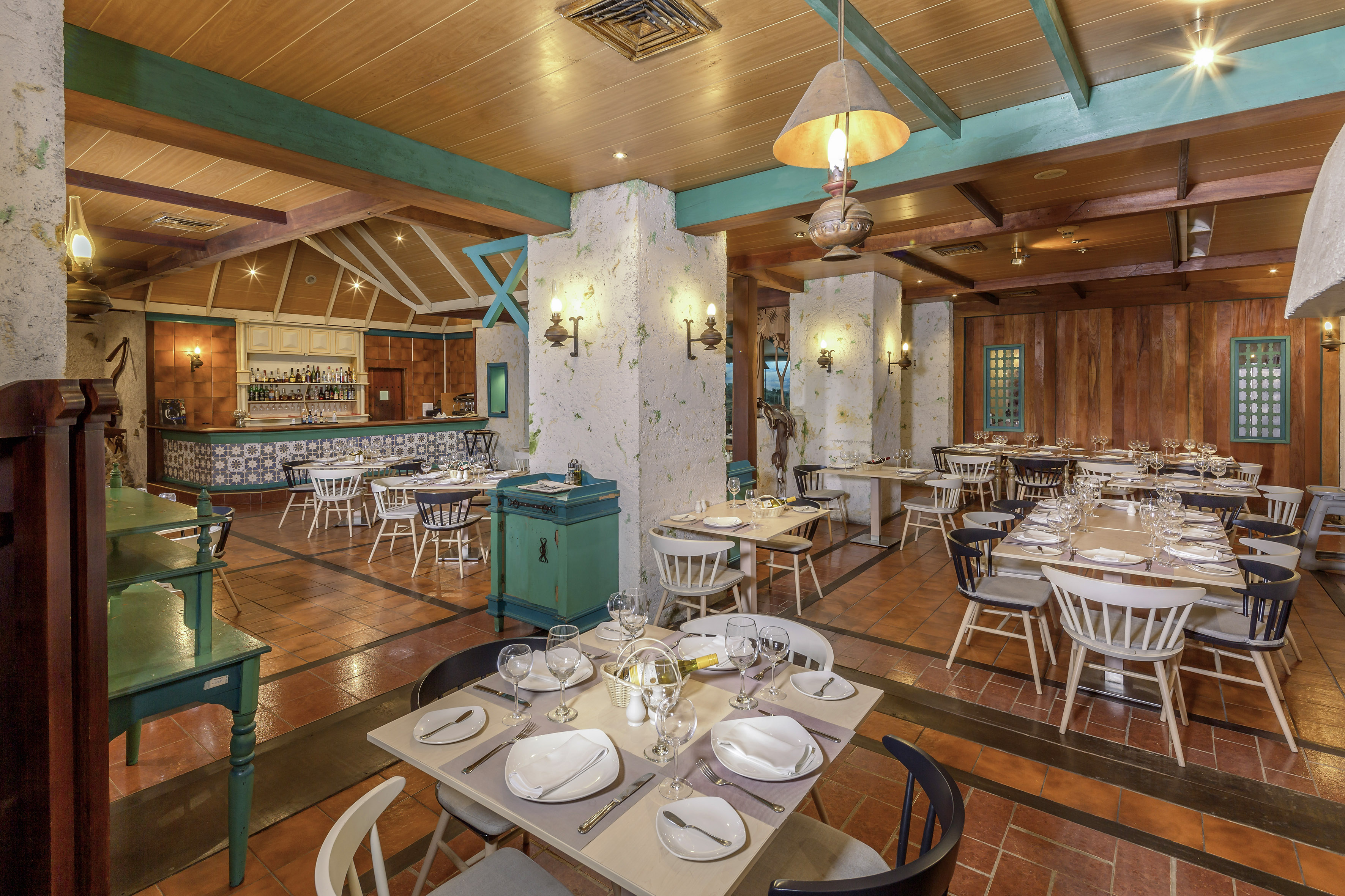 a restaurant with tables and chairs