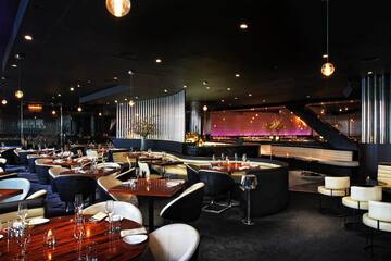 a restaurant with tables and chairs