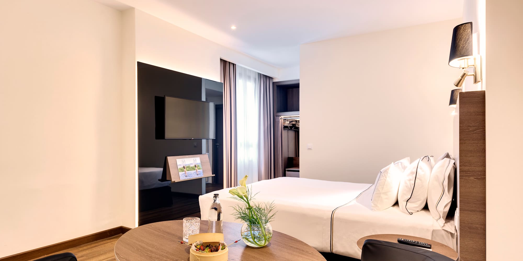 a room with a bed and a tv