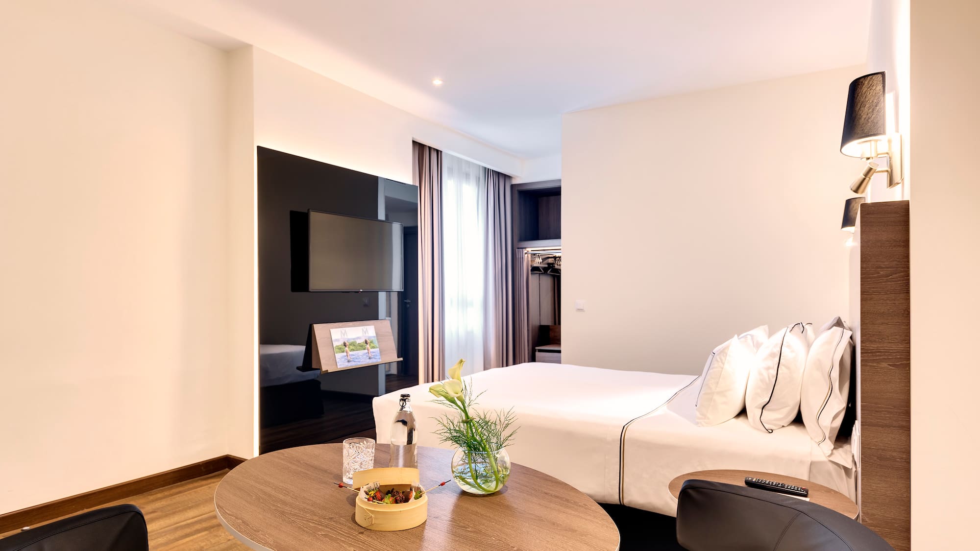 a room with a bed and a tv