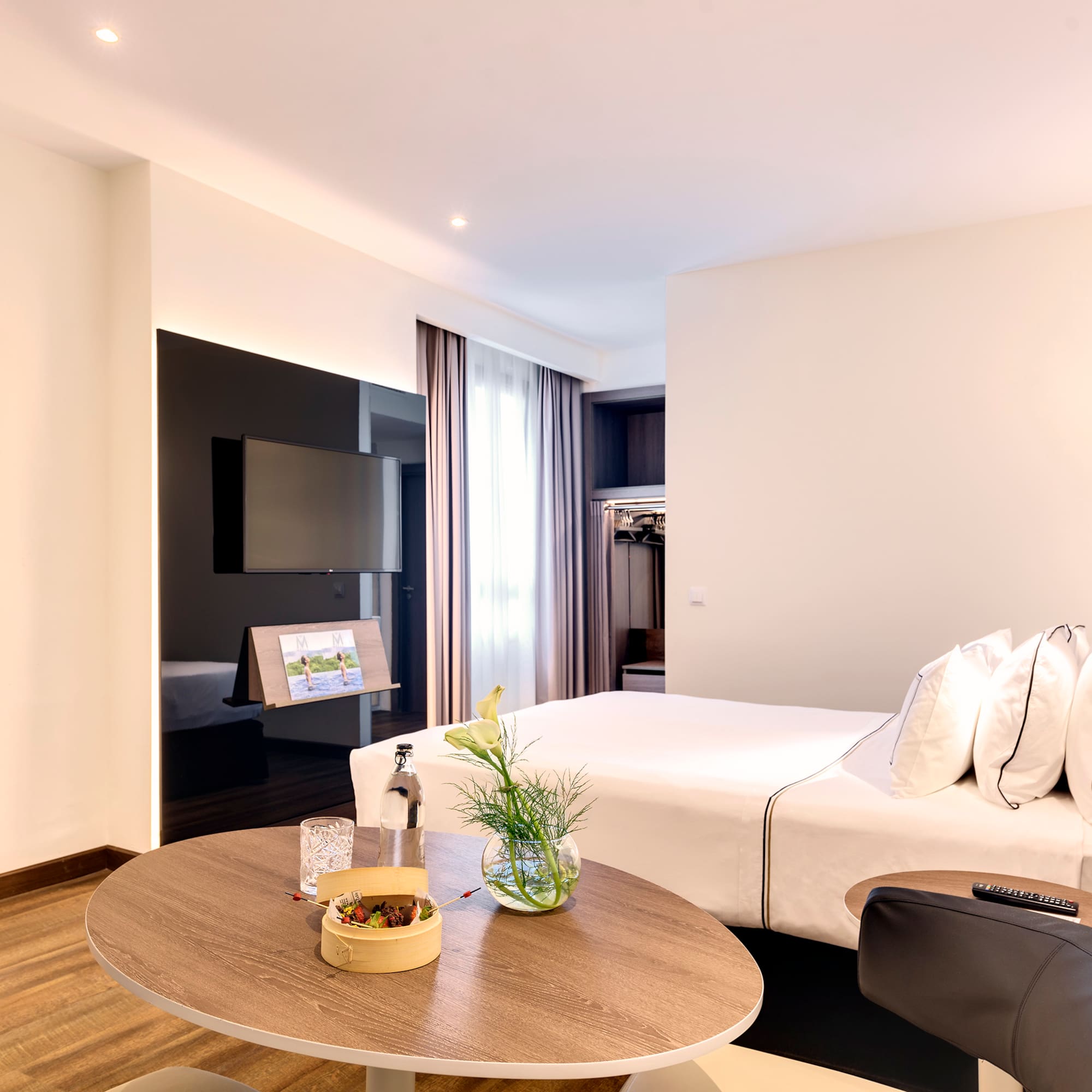 a room with a bed and a tv