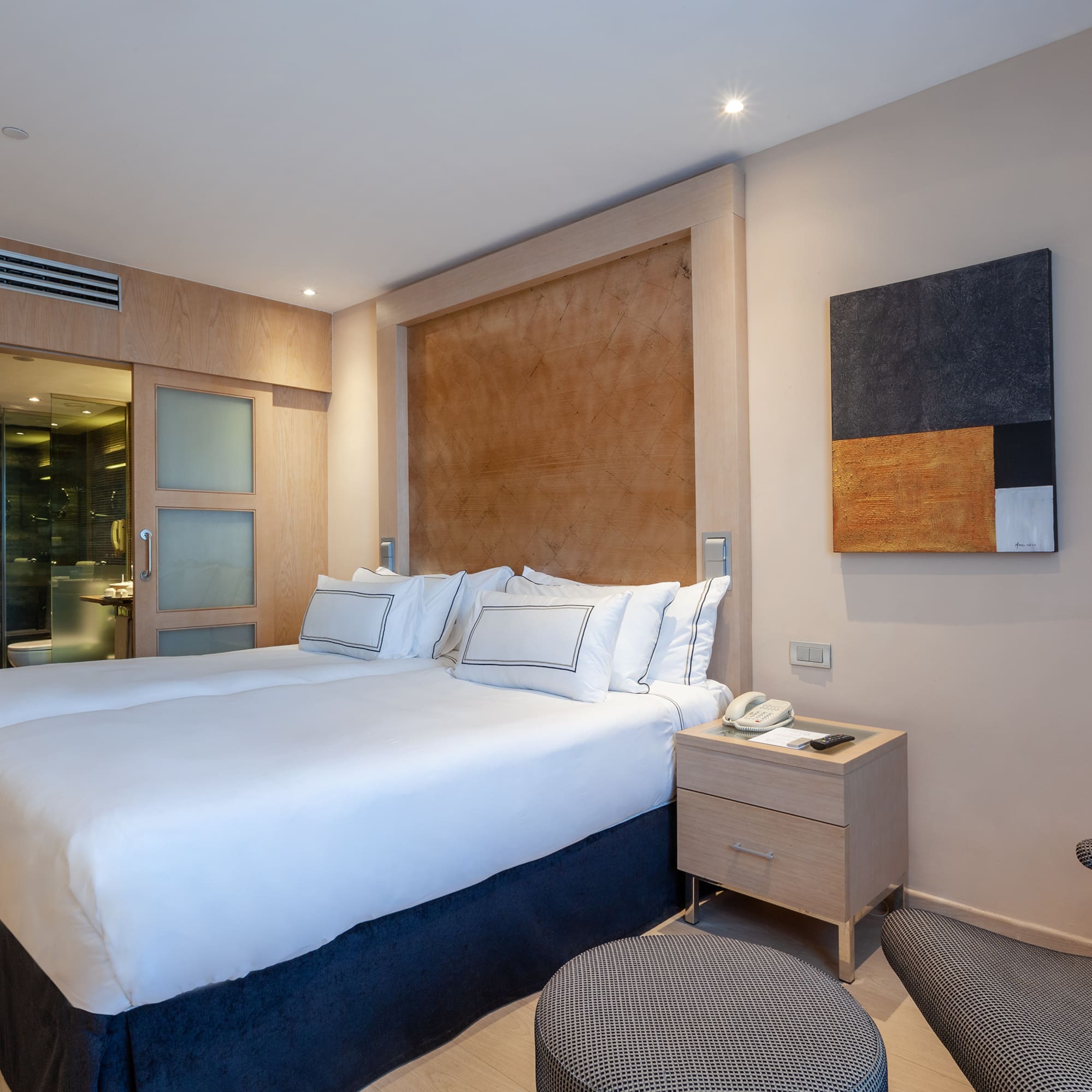 a bedroom with a bed and a table