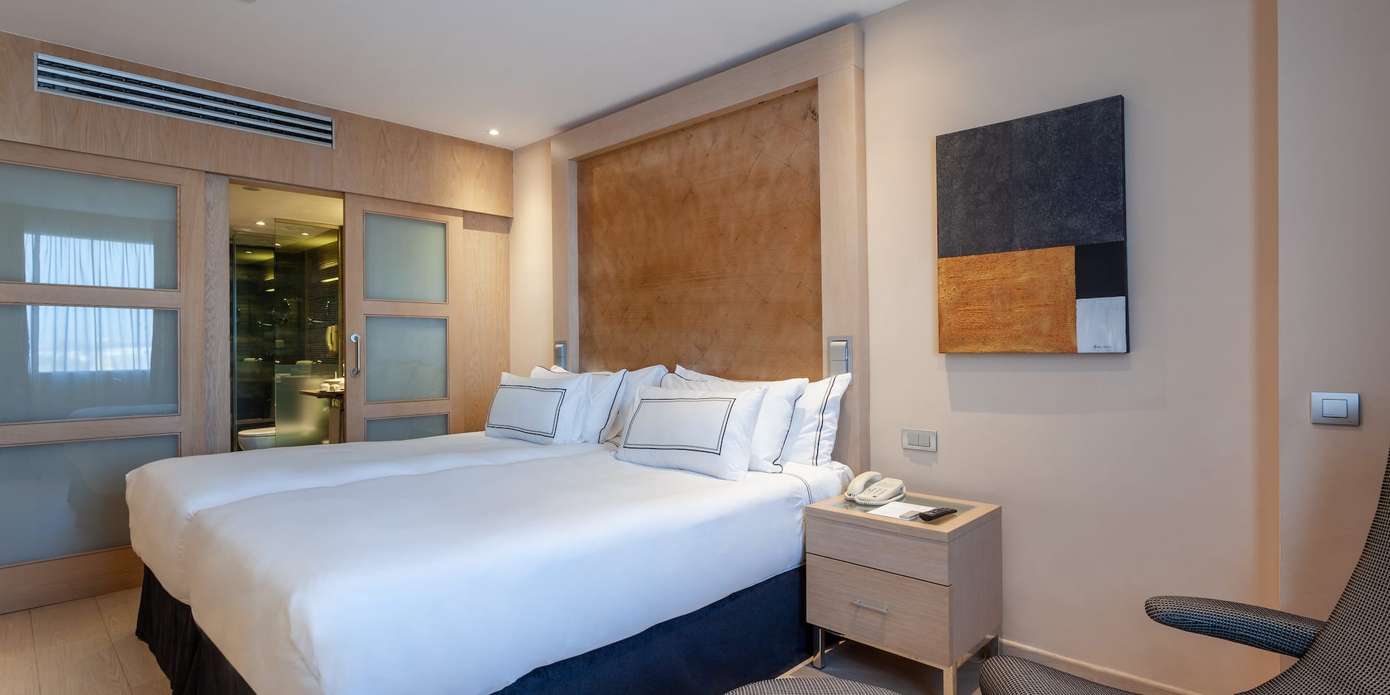 a bedroom with a bed and a table