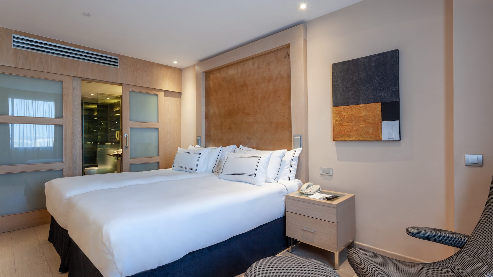 a bedroom with a bed and a table