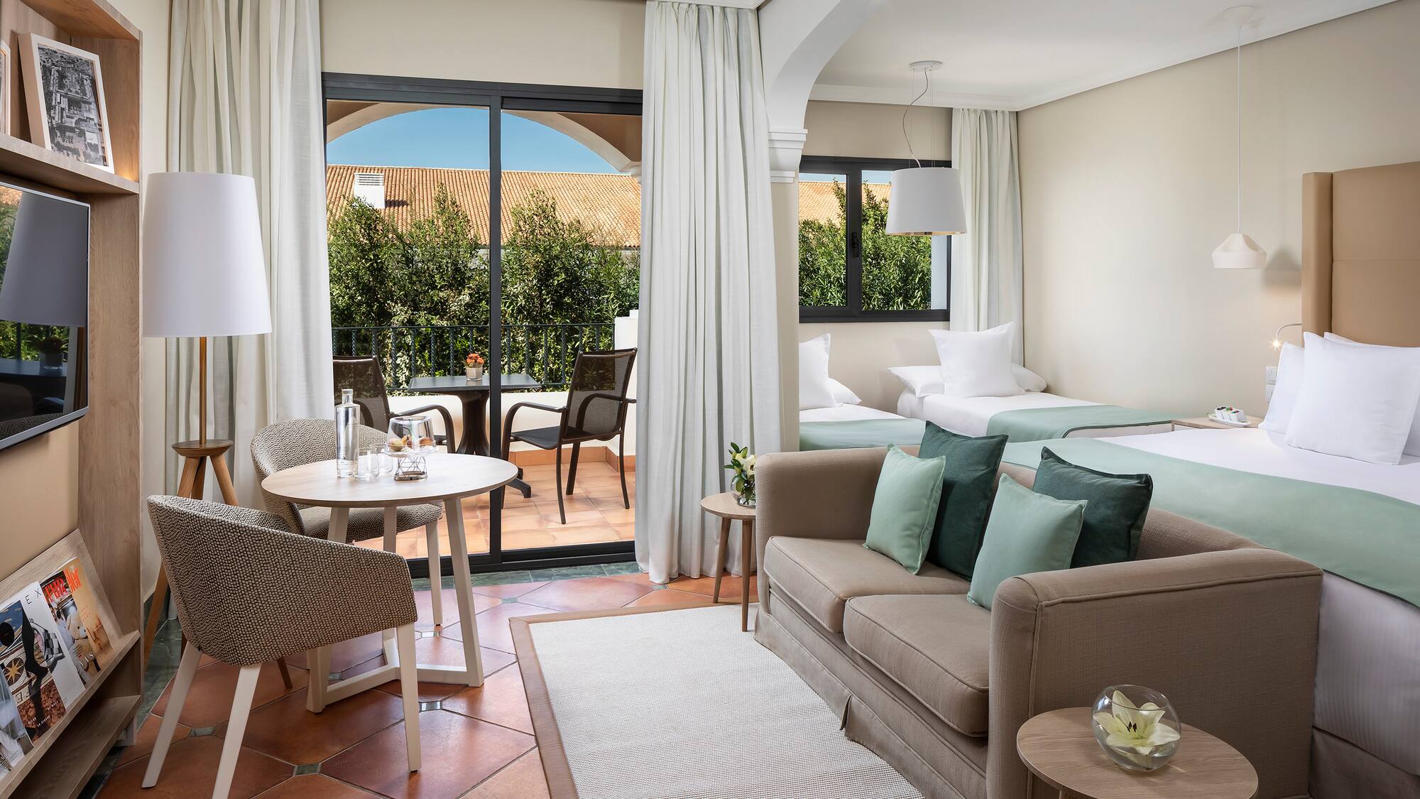 a room with a bed and a sofa