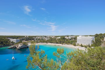 a beach with trees and buildings
