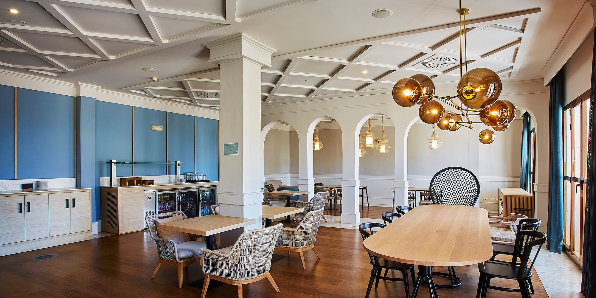 a room with a large table and chairs