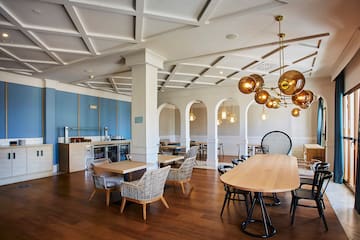 a room with a large table and chairs