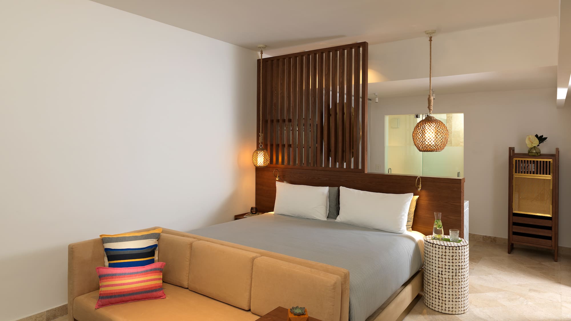 a bed with pillows and a table in a room