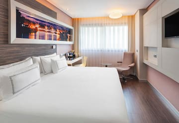 a room with a bed and a chair