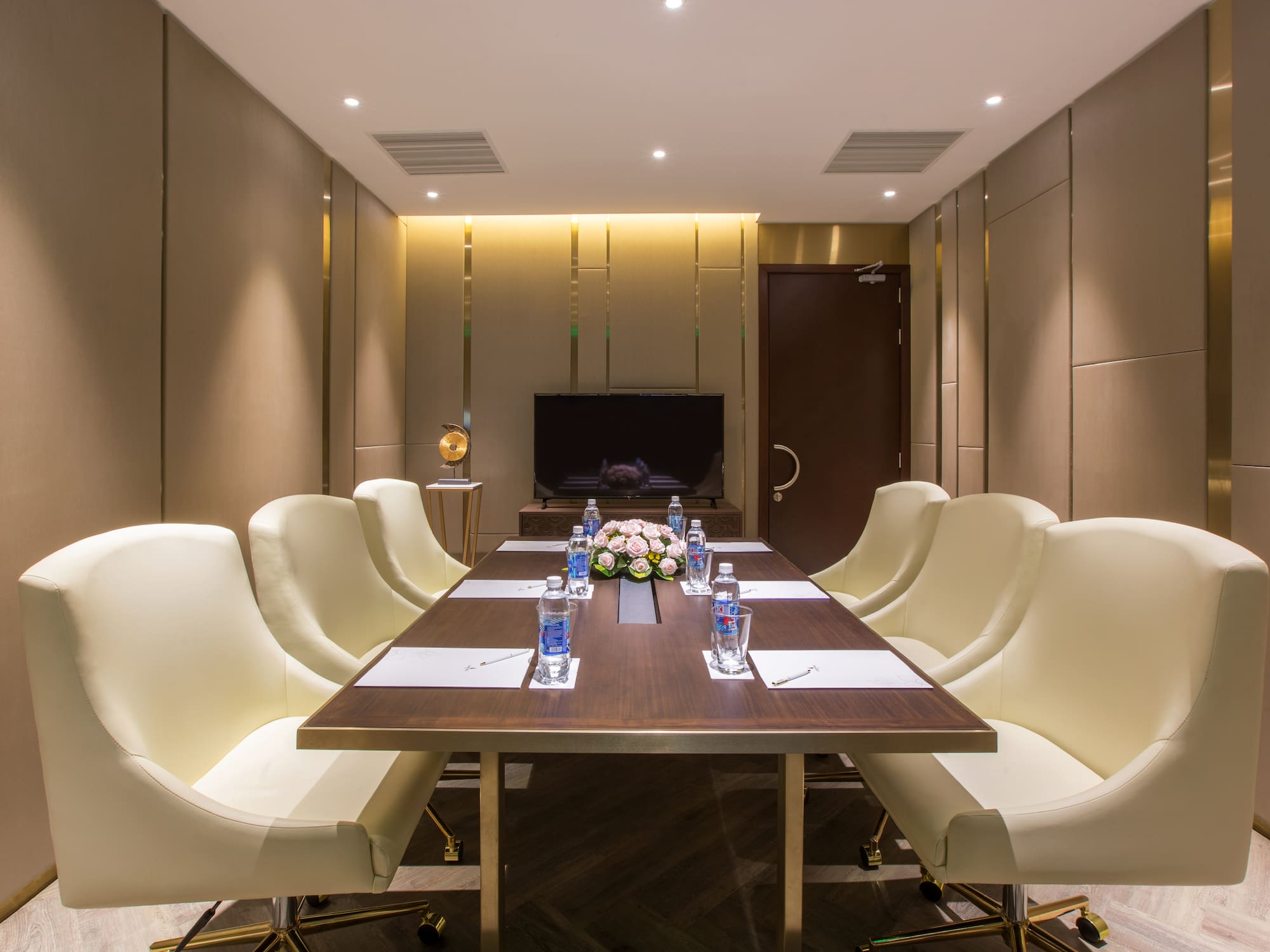 a conference room with a table and chairs