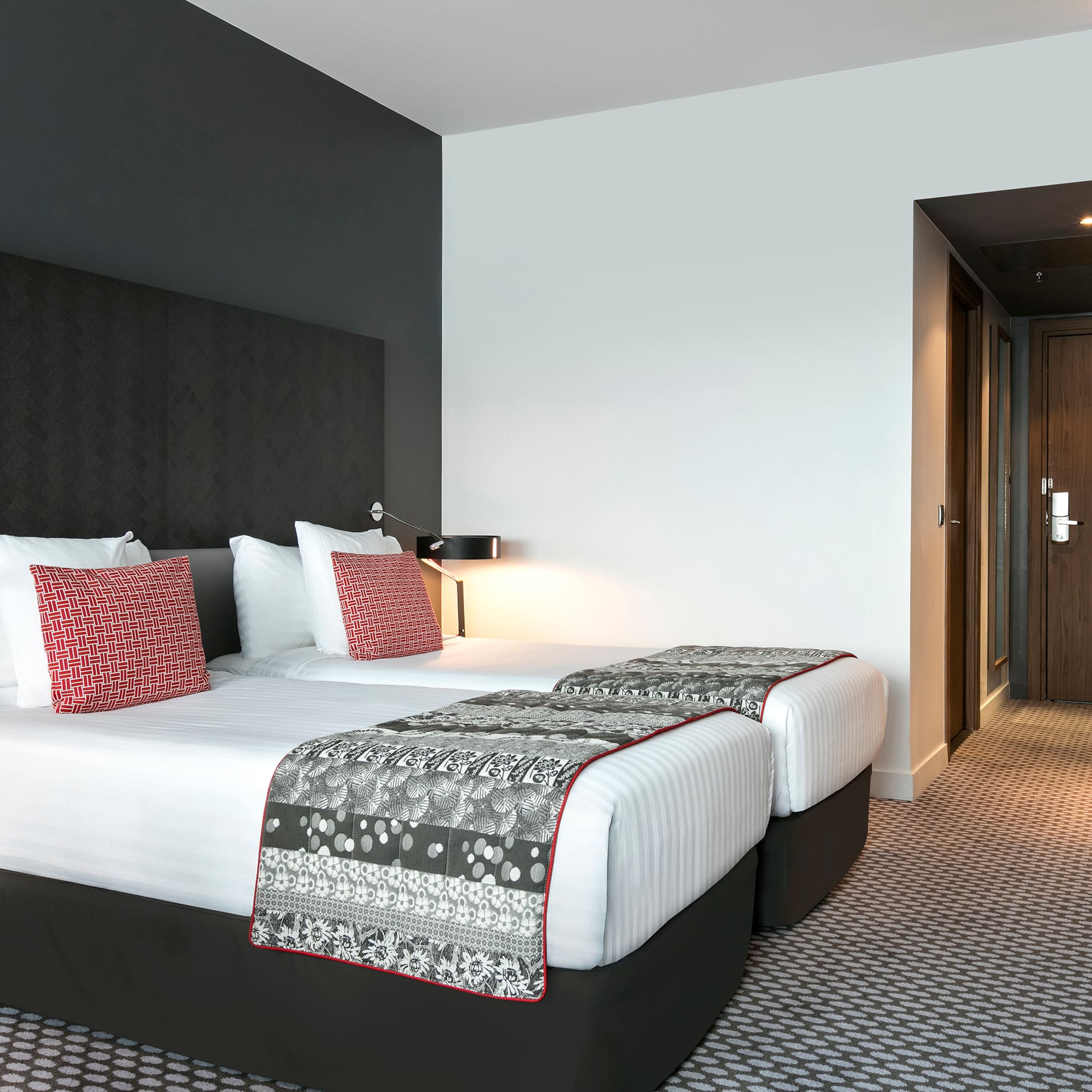 a hotel room with two beds