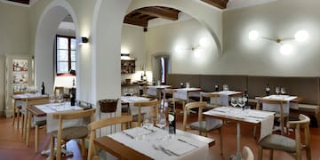 a restaurant with tables and chairs