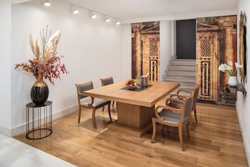 a dining room with a table and chairs