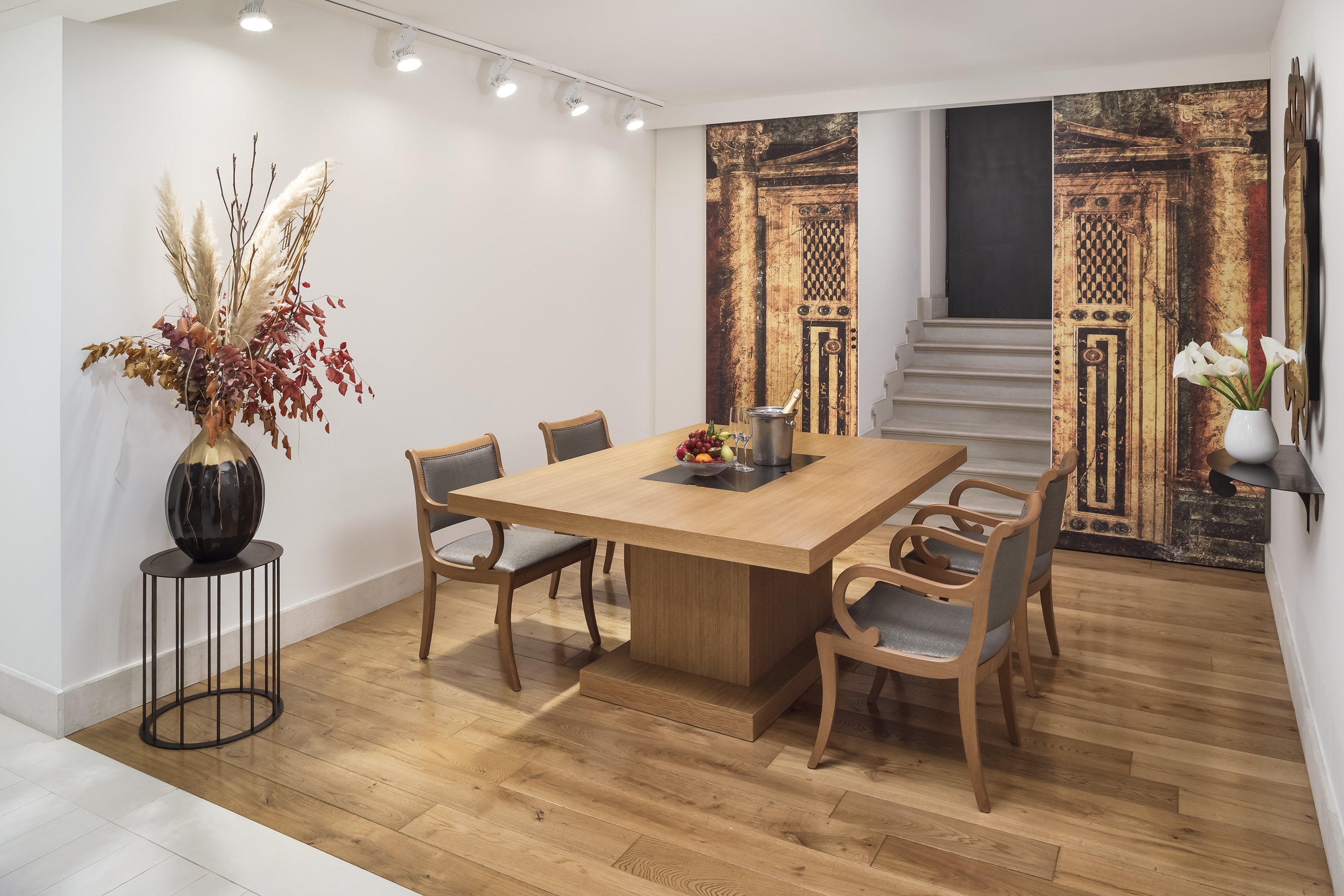 a dining room with a table and chairs