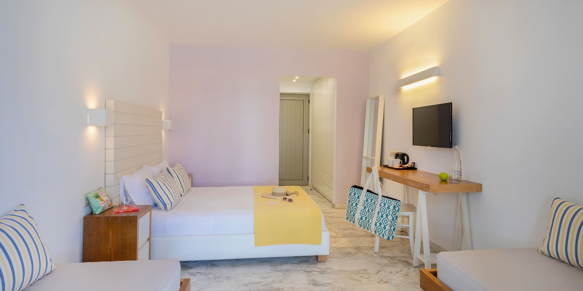 a room with a bed and a television