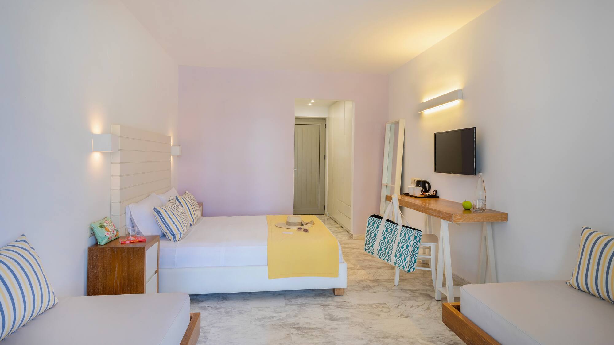 a room with a bed and a television